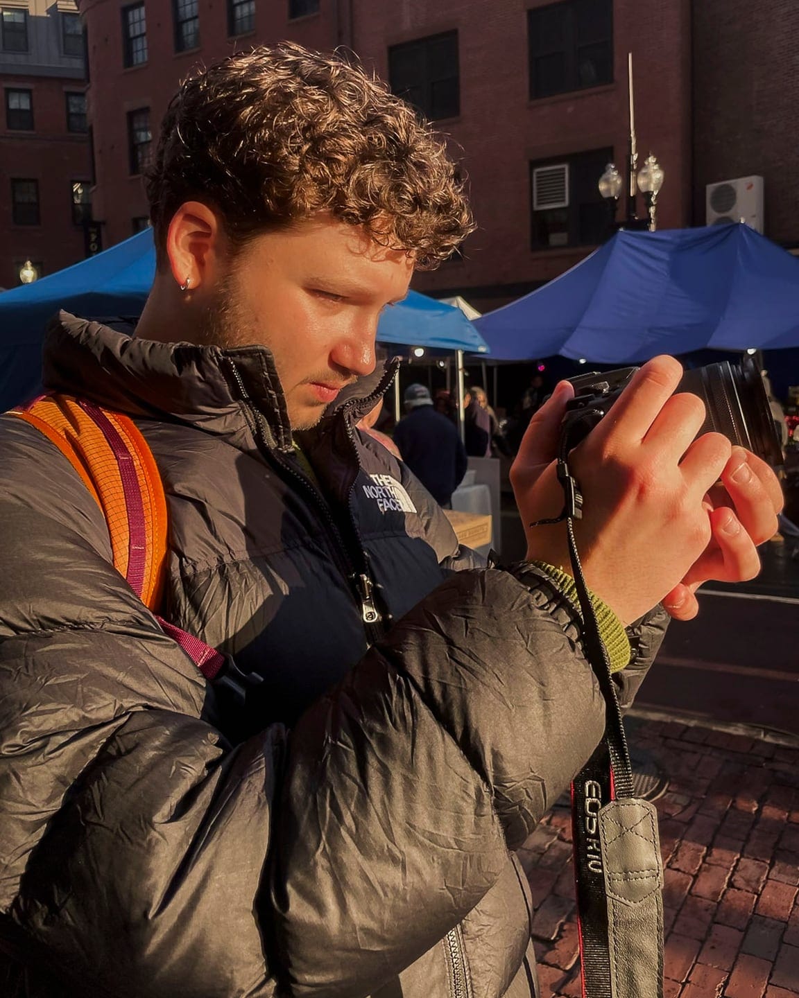 Luca photographing with a camera