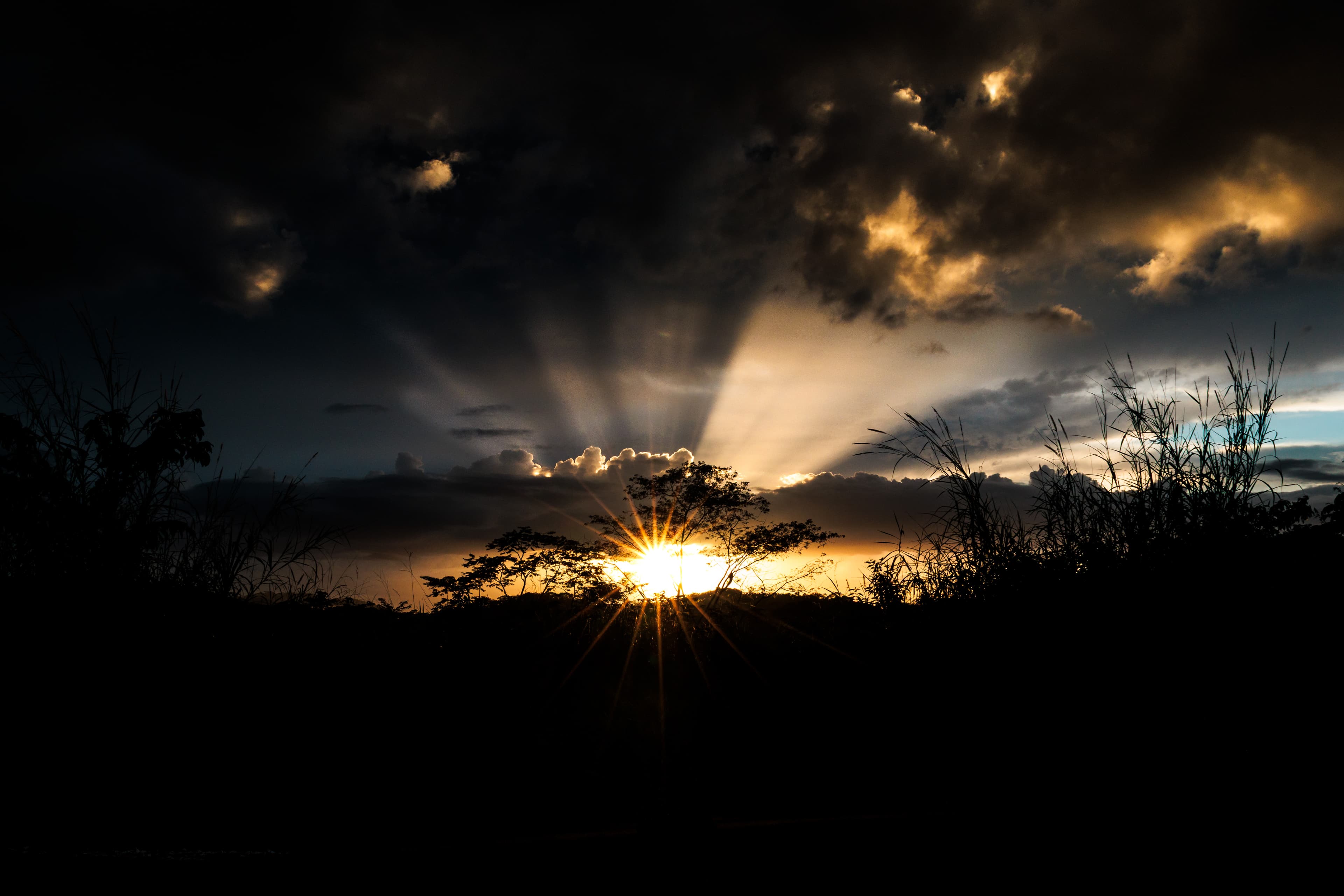 Sunset clouds glowing over a darkening sky.