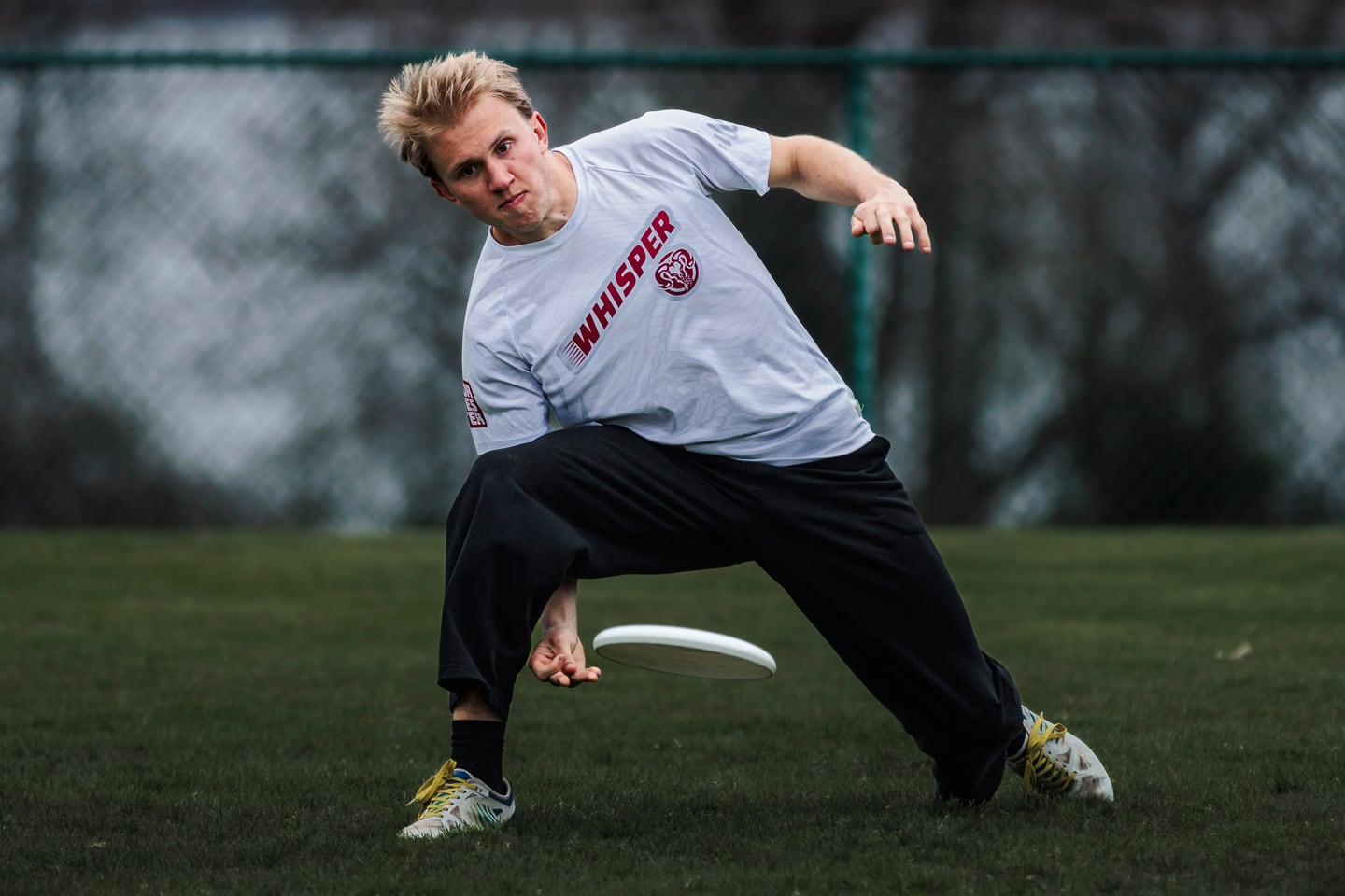 Player readying a low throw in a ready stance.