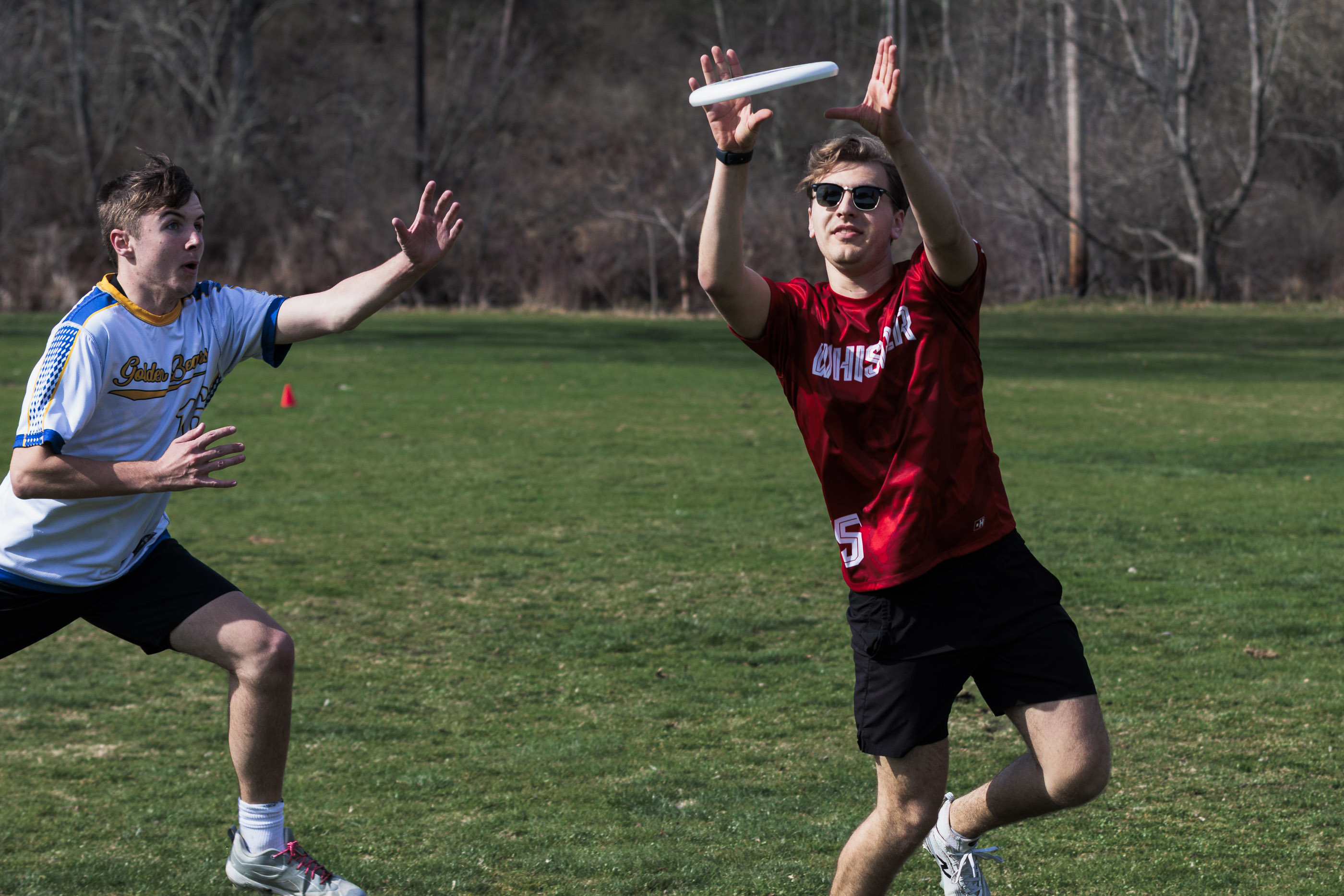 Reach for a red disc against a dark stadium backdrop.