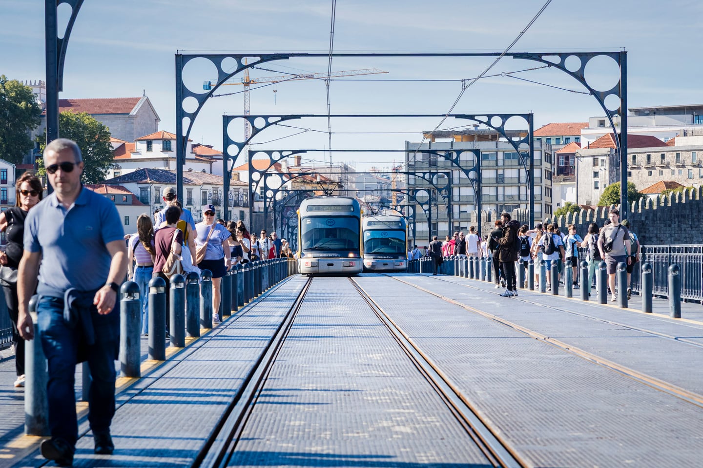 A bridge with tram tracks leading into the city.